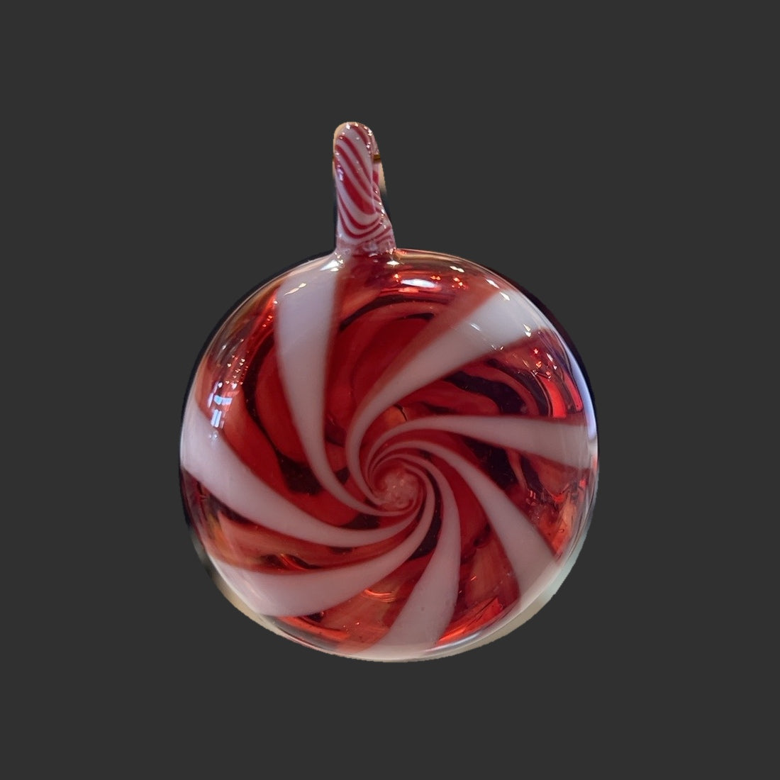 Handmade hollow red and white peppermint swirl glass ornament